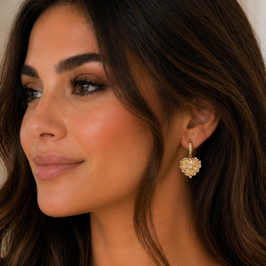 Woman wearing a heart-shaped earring with a blurred background